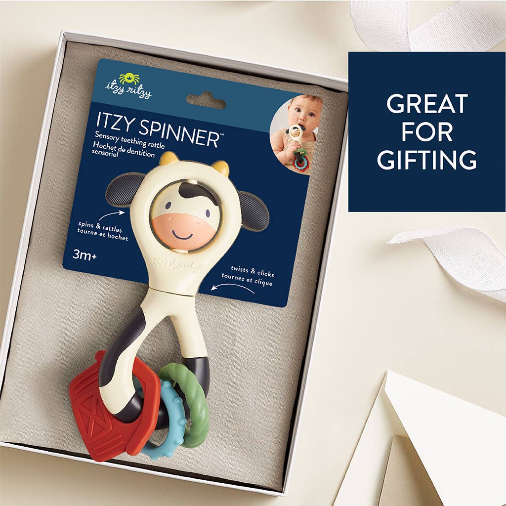 Itzy Spinner™ | Sensory Teething Rattle | Carmen the Cow