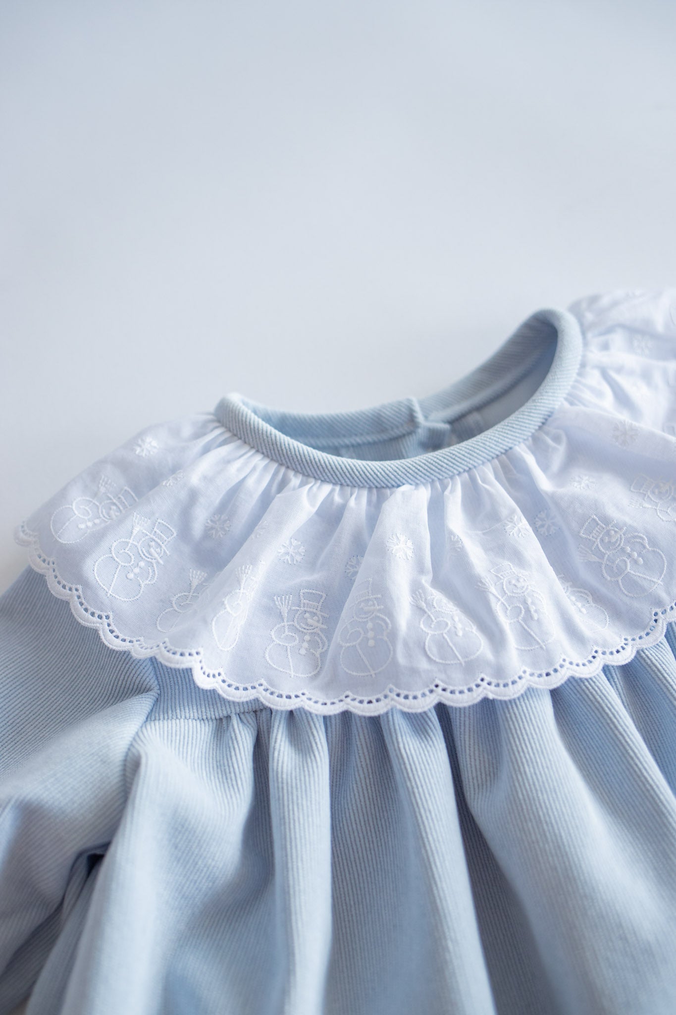 Soft Blue Corduroy Dress with Snowman Lace