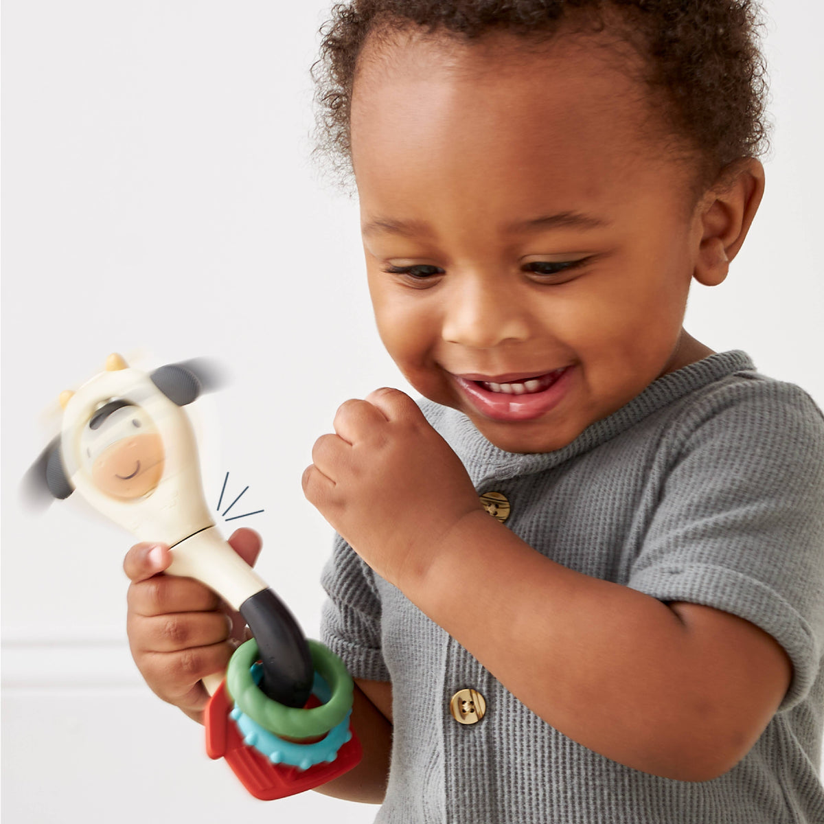 Itzy Spinner™ | Sensory Teething Rattle  | Carmen the Cow