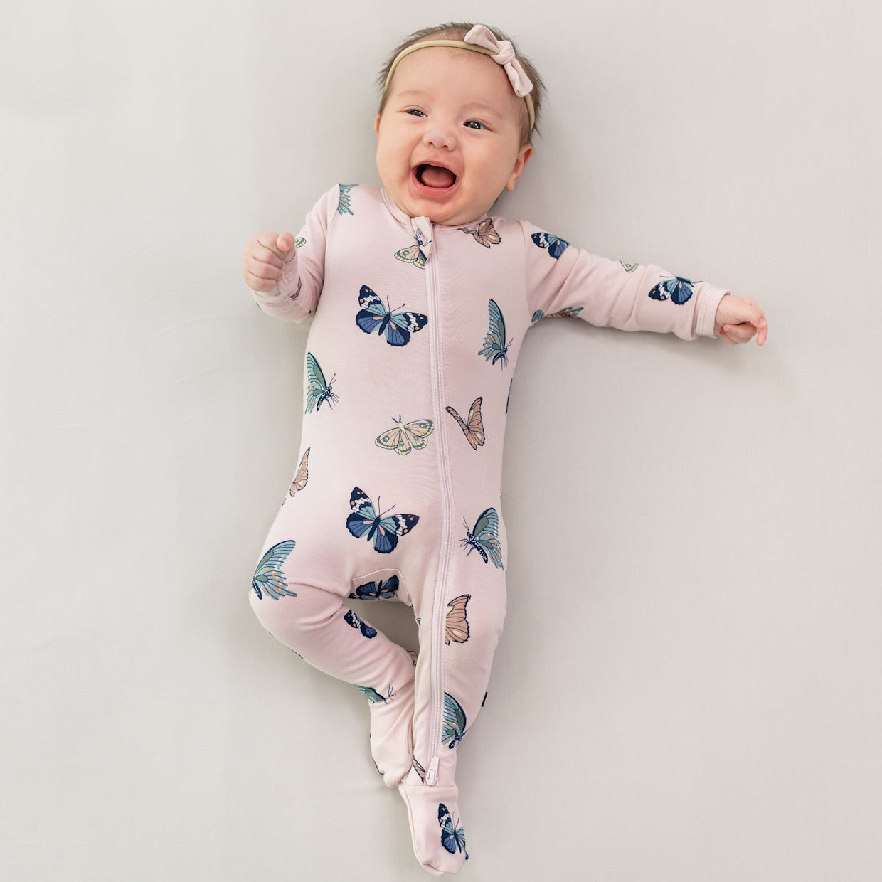 Kyte Baby Zippered Bamboo Footie | Blush Butterfly